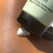 SPF 50 Natural Physical Sunscreen being dispensed from the tube, showing its lightweight formula.